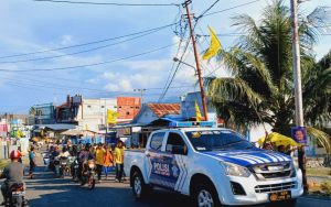 Polres Touna Kawal dan Amankan Jalan Sehat HUT Golkar ke 59