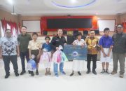 Bupati Banggai Ir. H. Amirudin, M.M., AIFO Menghadiri Acara Program BNI Berbagi Natal Tahun 2024